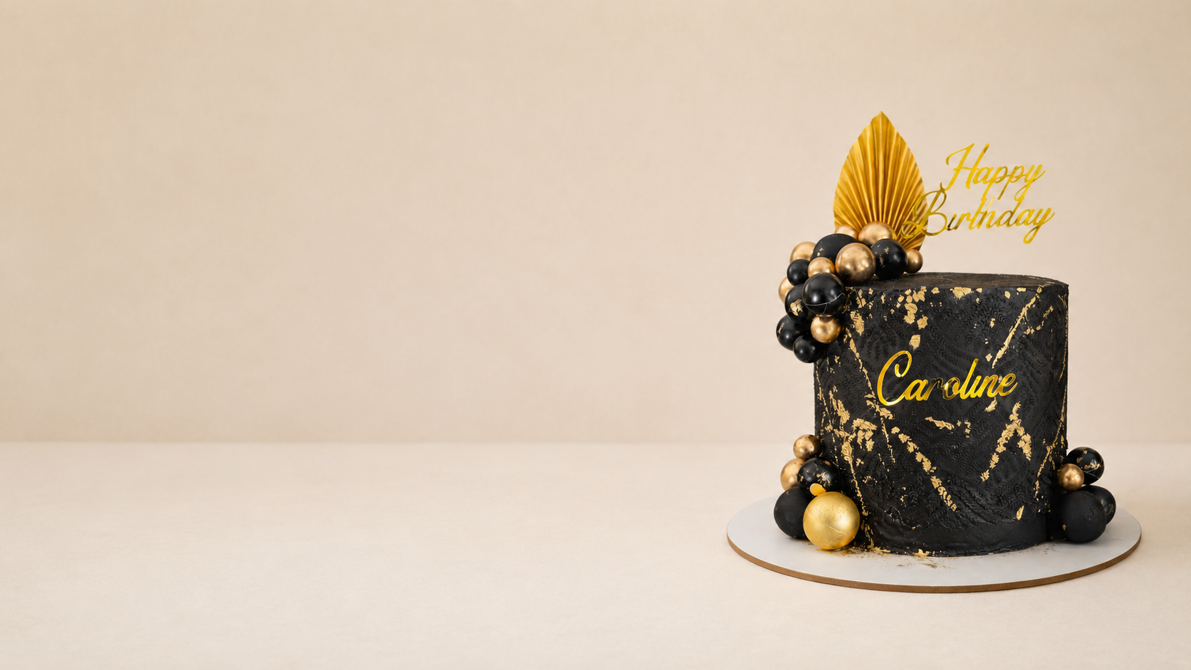Custom black and gold birthday cake by Cakes by Teez Luxury black and gold custom birthday cake with edible gold leaf and personalised topper by Cakes by Teez in Abuja